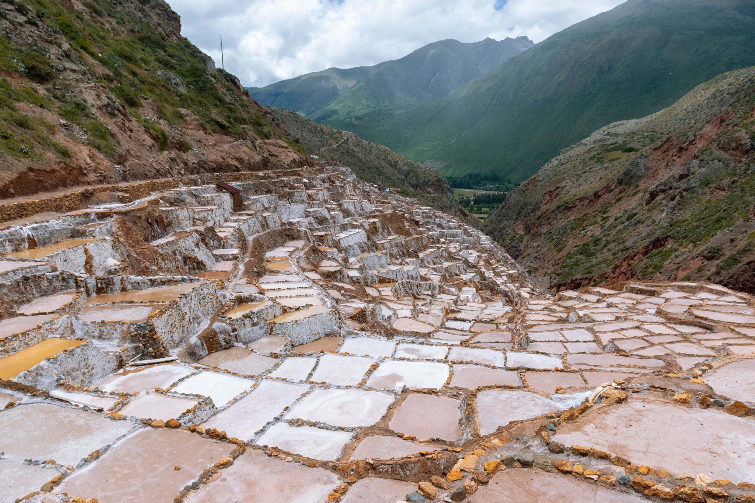Green landscape of Peru's Sacred Valley framed by Andean mountains